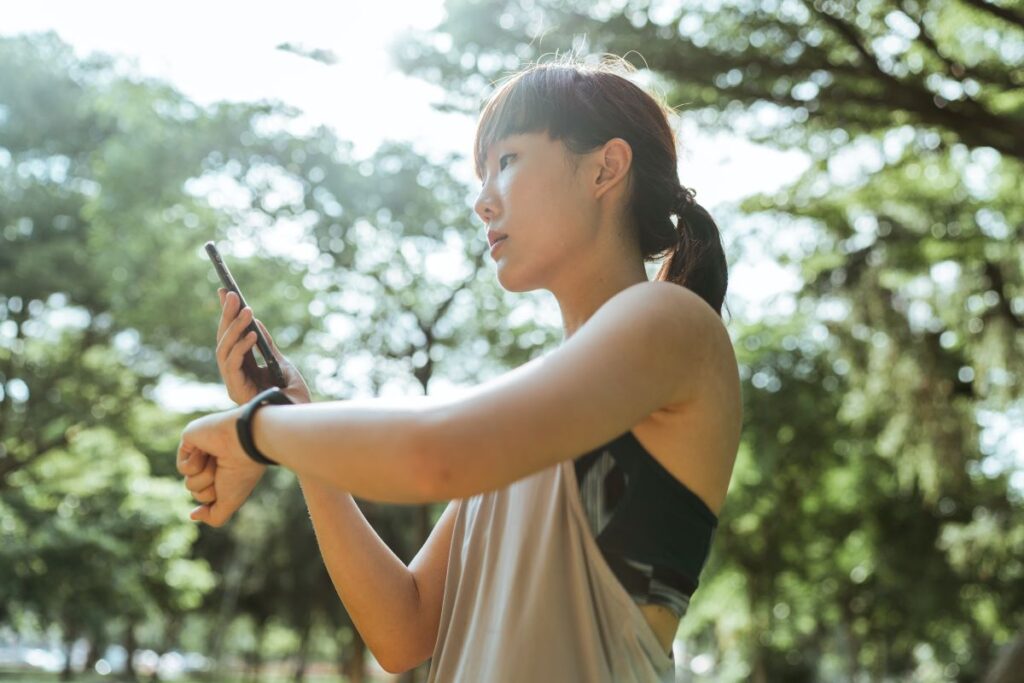 woman checking fitbit