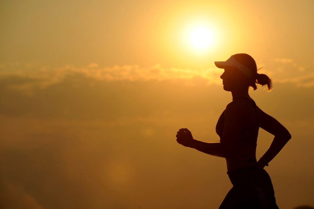 women running in sunrise