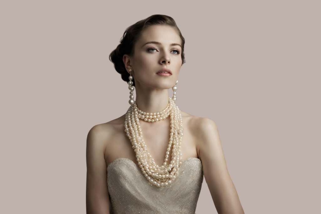 woman in a pearl necklace and earrings in strapless dress